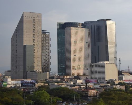 A modern corporate building facade on Paseo de la Reforma in Mexico City