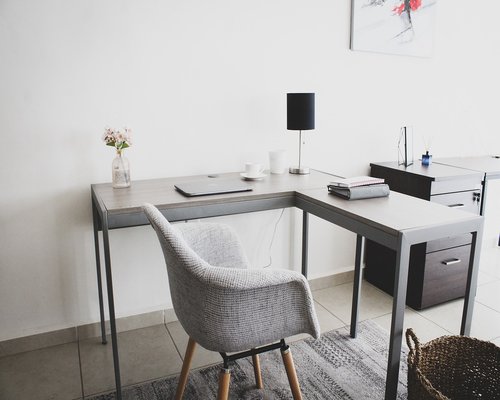 A clean and calm creative office space interior with wooden details