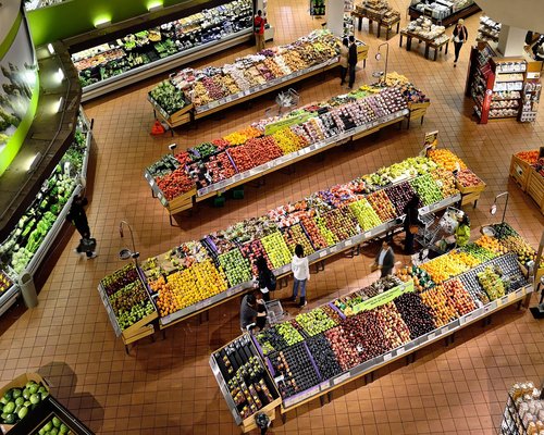 A colorful traditional Mexican market stall displaying fresh fruits and vegetables